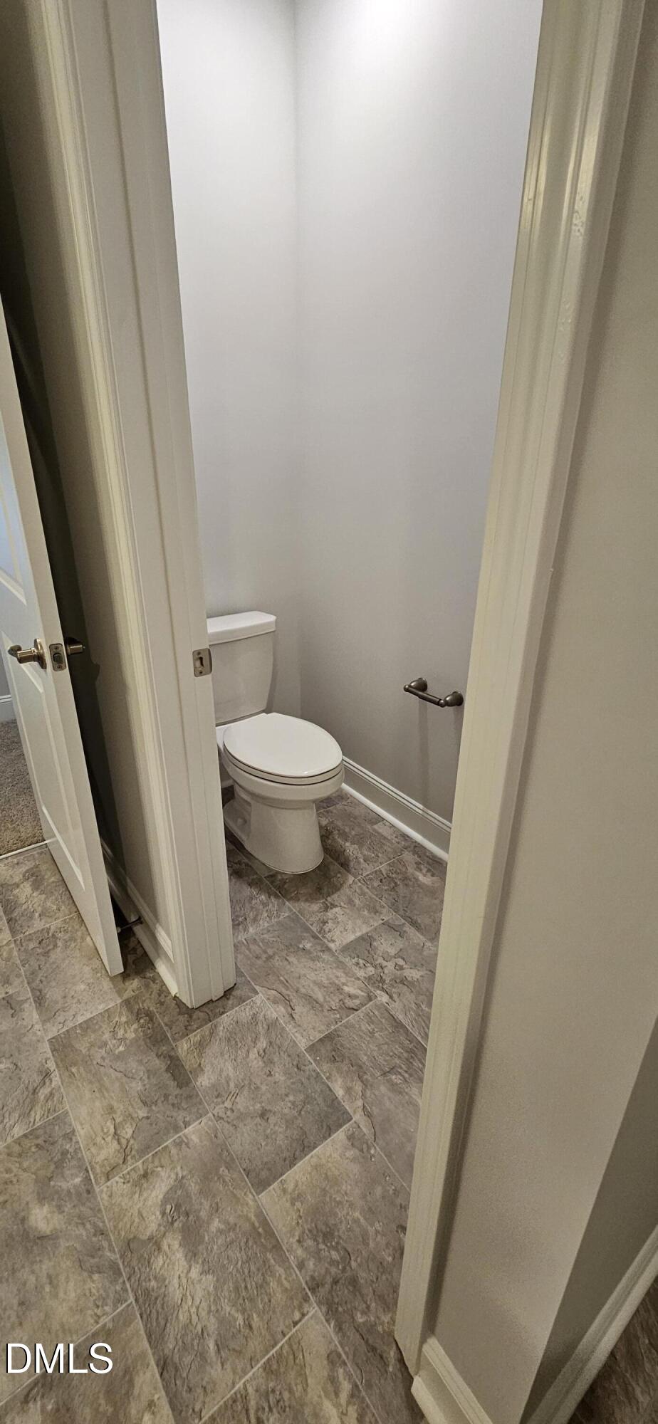 56 Braddock Court Garner, NC 27529 - Photo 40 of 55 a white toilet sitting next to a sink