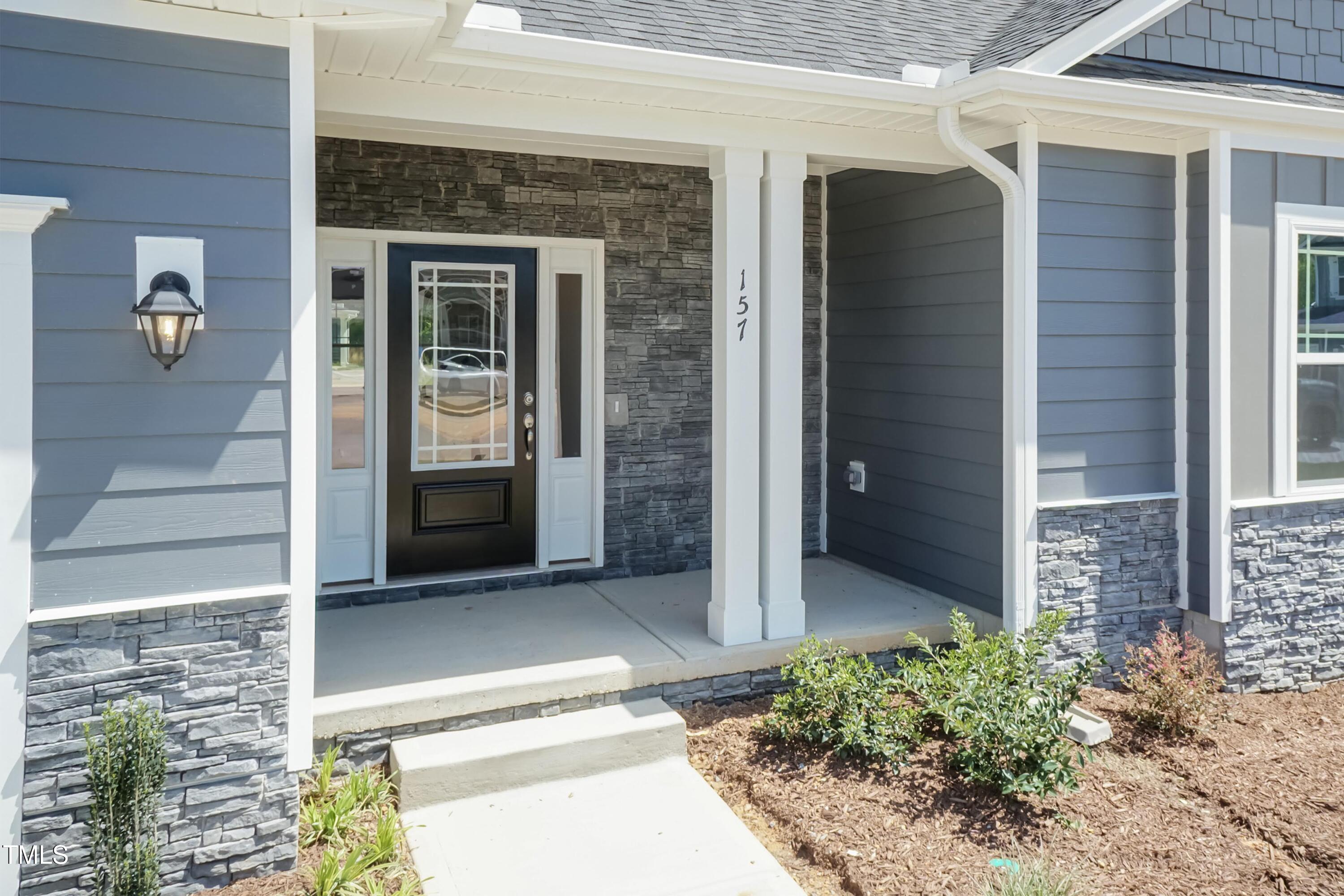 56 Braddock Court Garner, NC 27529 - Photo 45 of 55 a front view of a house with a porch