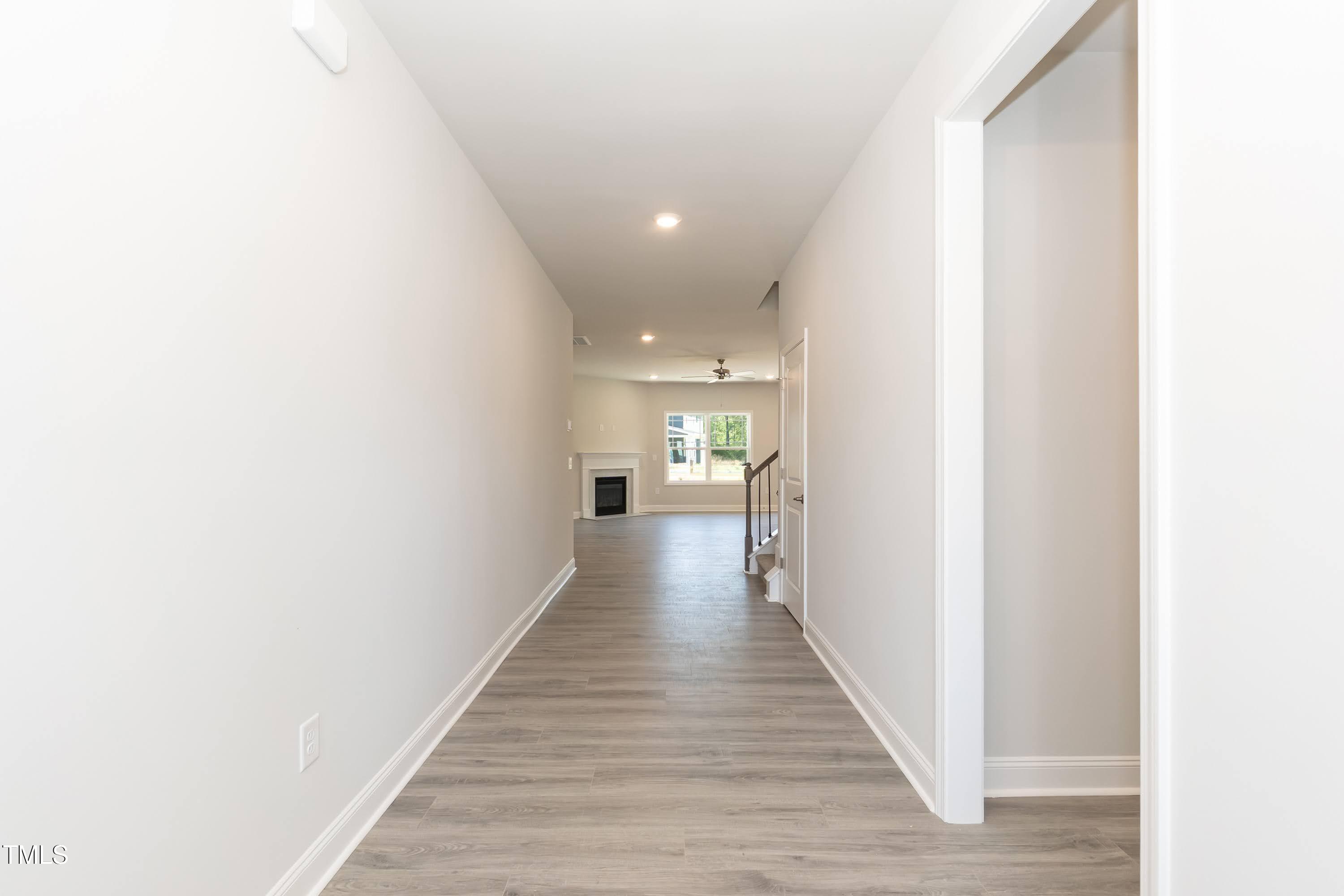 56 Braddock Court Garner, NC 27529 - Photo 8 of 55 a view of a hallway with wooden floor