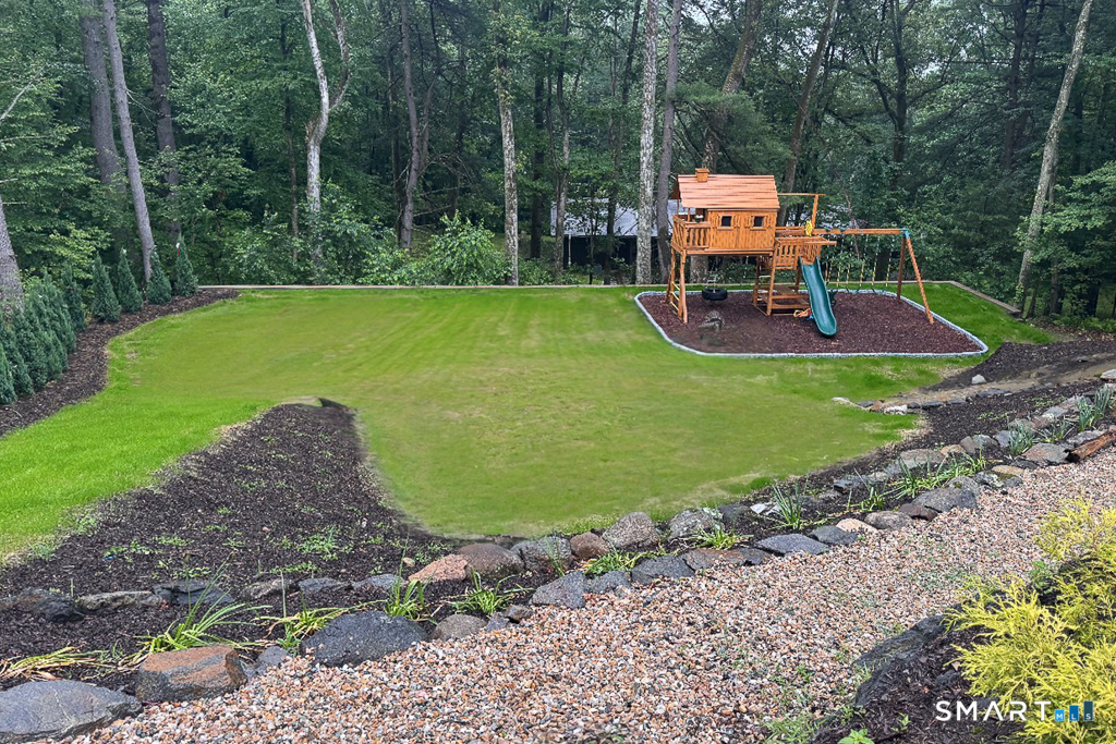34 Milan Road Woodbridge, CT 06525 - Photo 33 of 40 The Sellers created this play area by taking down trees, having several deliveries of fill and soil, and significant landscaping.