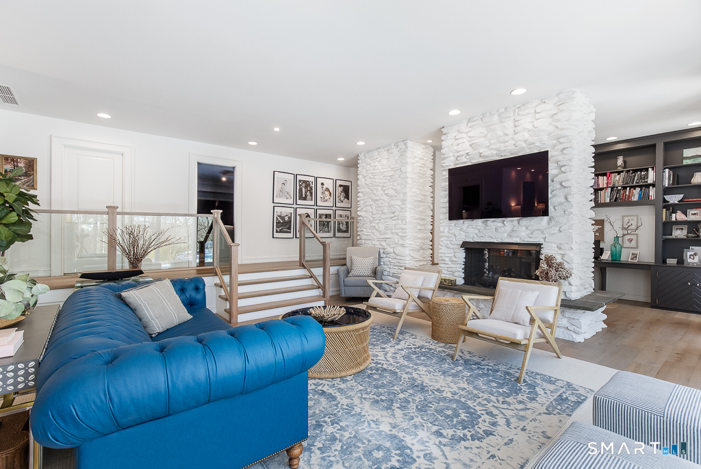 34 Milan Road Woodbridge, CT 06525 - Photo 8 of 40 Please note the 2-sided gas fireplace