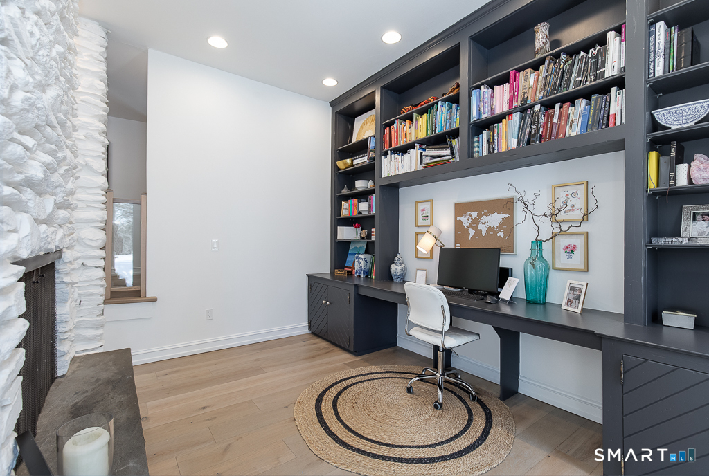 34 Milan Road Woodbridge, CT 06525 - Photo 10 of 40 Office area at the far end of the living room behind the 2-sided gas fireplace.