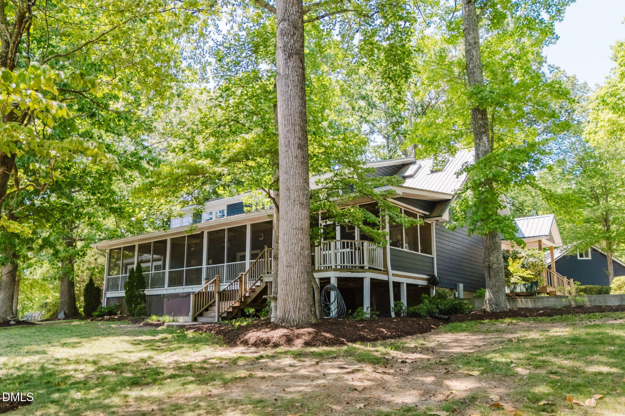370 Robinson Ferry Road Macon, NC 27551 - Photo 55 of 85 a view of a house with backyard porch and sitting area