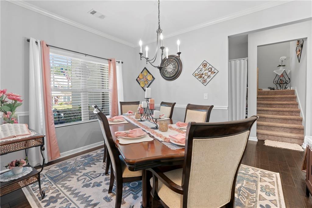 420 Andrew Ridge Drive Jefferson, GA 30549 - Photo 13 of 26 a view of a dining room with furniture window and wooden floor