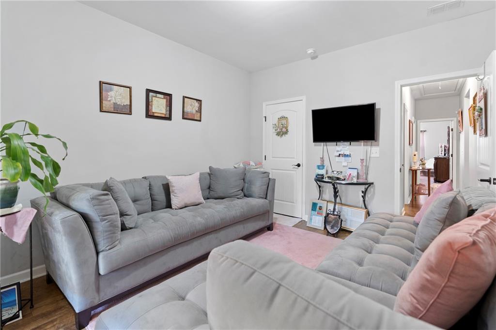 420 Andrew Ridge Drive Jefferson, GA 30549 - Photo 18 of 26 a living room with furniture and a flat screen tv