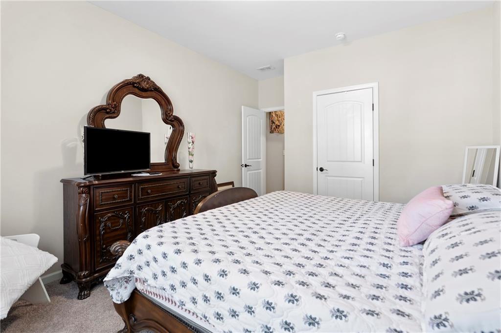 420 Andrew Ridge Drive Jefferson, GA 30549 - Photo 22 of 26 a bedroom with a bed and a television