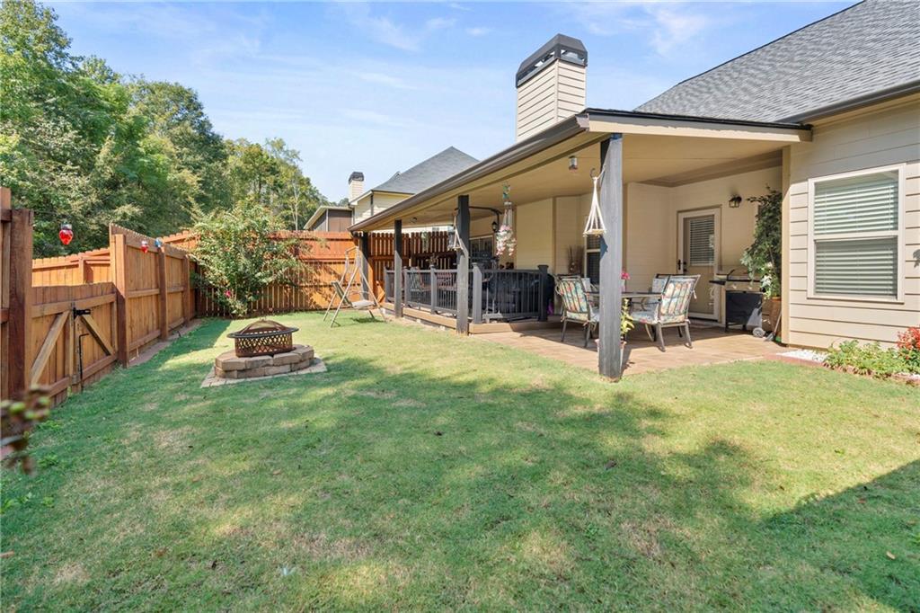 420 Andrew Ridge Drive Jefferson, GA 30549 - Photo 3 of 26 a view of a chair and table in backyard of the house