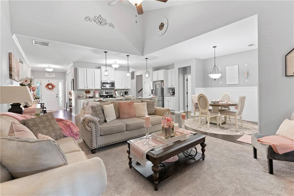 420 Andrew Ridge Drive Jefferson, GA 30549 - Photo 6 of 26 a living room with furniture kitchen view and a chandelier