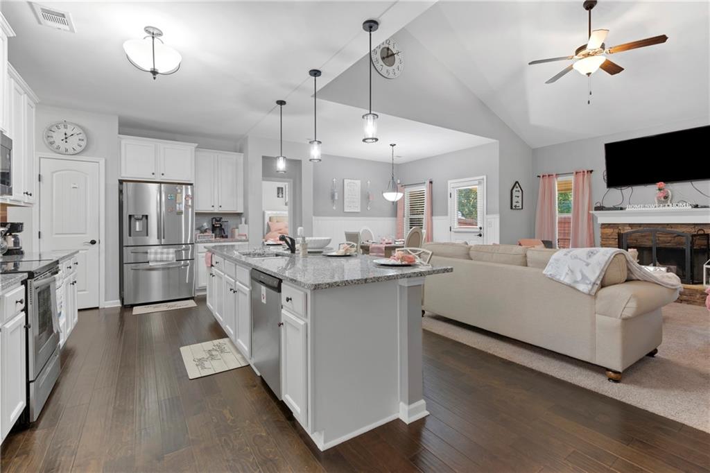 420 Andrew Ridge Drive Jefferson, GA 30549 - Photo 7 of 26 a large white kitchen with cabinets a sink and a stove