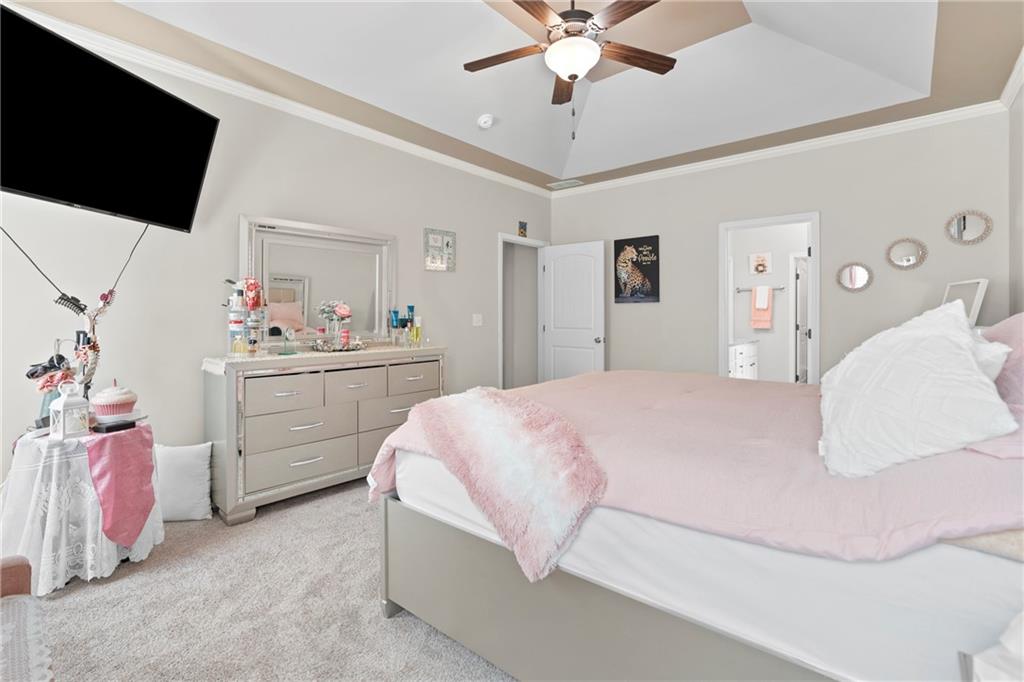 420 Andrew Ridge Drive Jefferson, GA 30549 - Photo 9 of 26 a bedroom with a bed and a flat screen tv