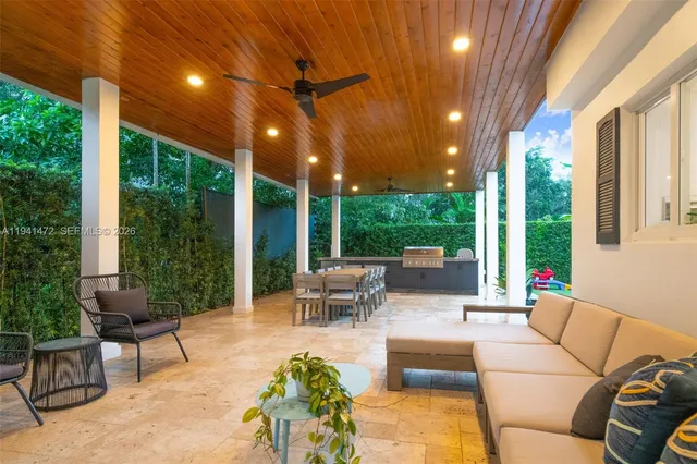 a outdoor living space with patio furniture and garden view