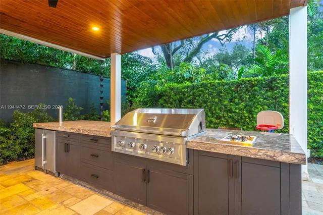 a view of a chairs and table in the patio