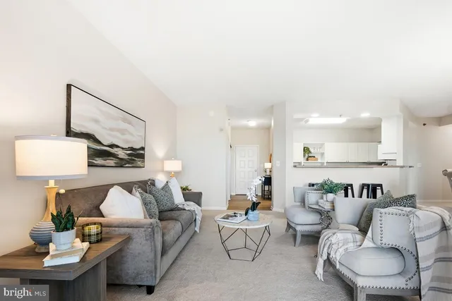 a living room with furniture and a lamp