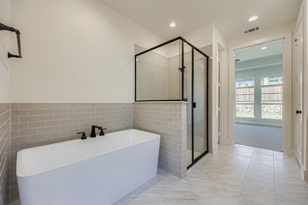 1841 Pk Vista Way Midlothian, TX 76065 - Photo 13 of 28 a bathroom with a bathtub and shower