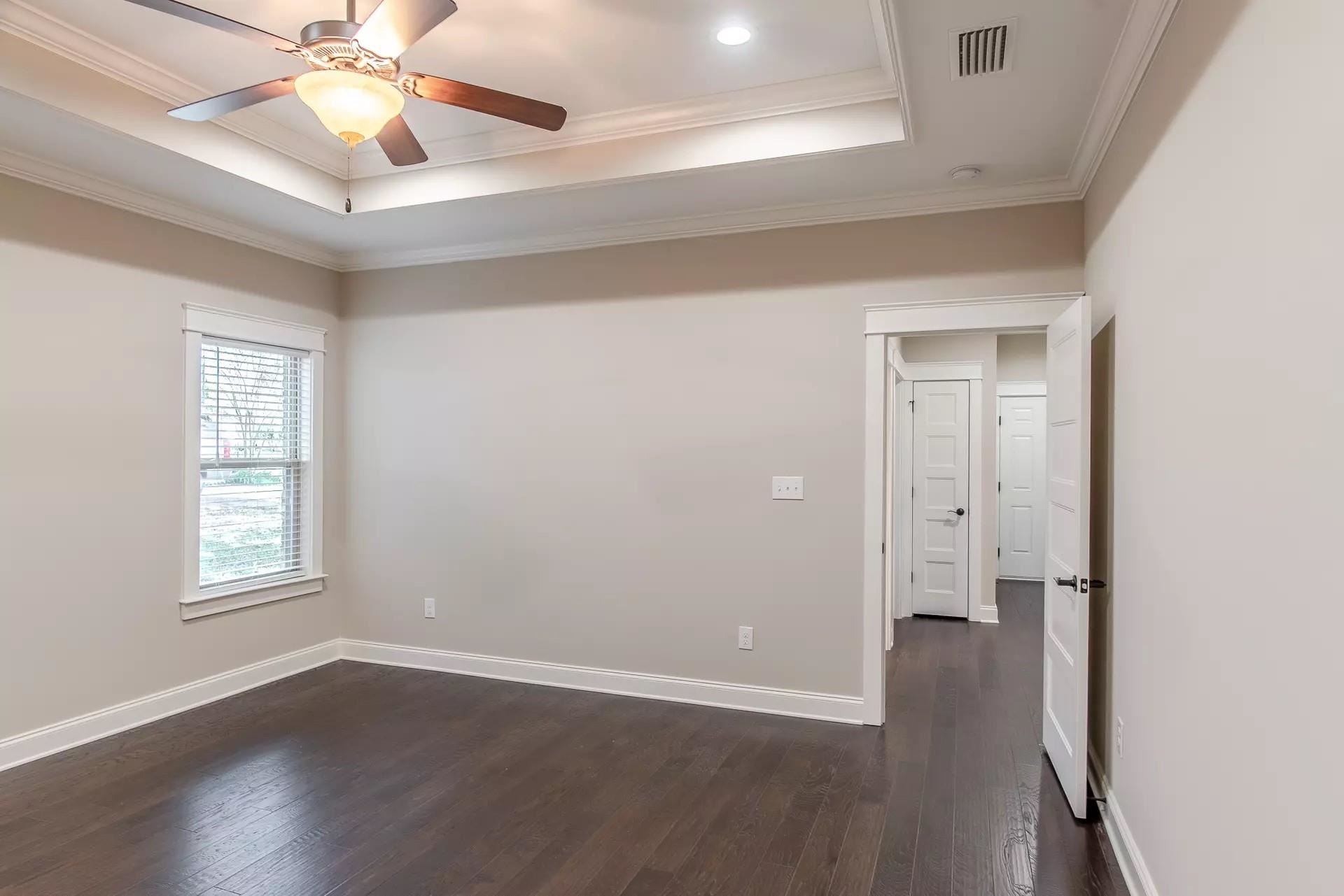 6288 Howie Way Pace, FL 32571 - Photo 17 of 27 an empty room with wooden floor fan and windows