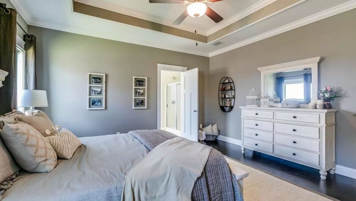 6288 Howie Way Pace, FL 32571 - Photo 5 of 27 a bedroom with a bed and a dresser