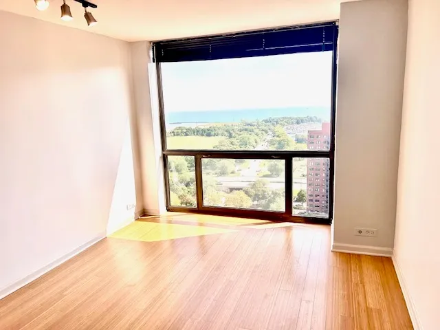 an empty room with large windows