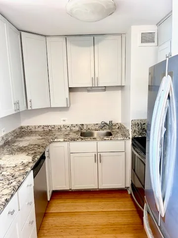 a bathroom with a sink toilet and a mirror
