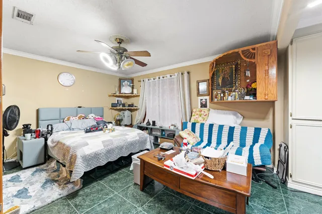 a bedroom with bed and a window