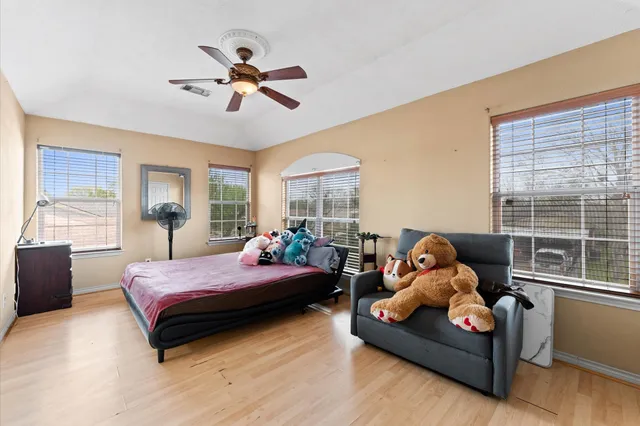 a bedroom with bed and window