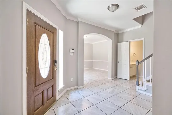 a view of an entryway with wooden floor