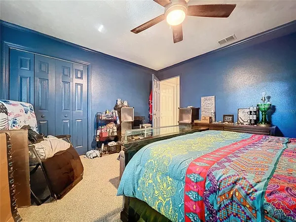 a bed room with a bed and a chandelier