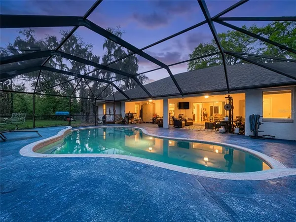 a view of a swimming pool with a patio