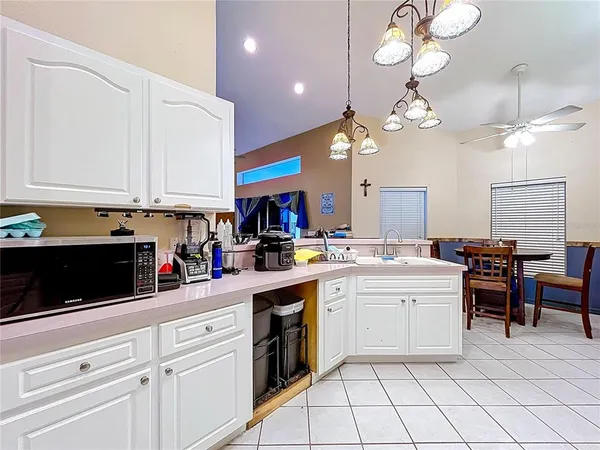 a kitchen with cabinets a sink and appliances
