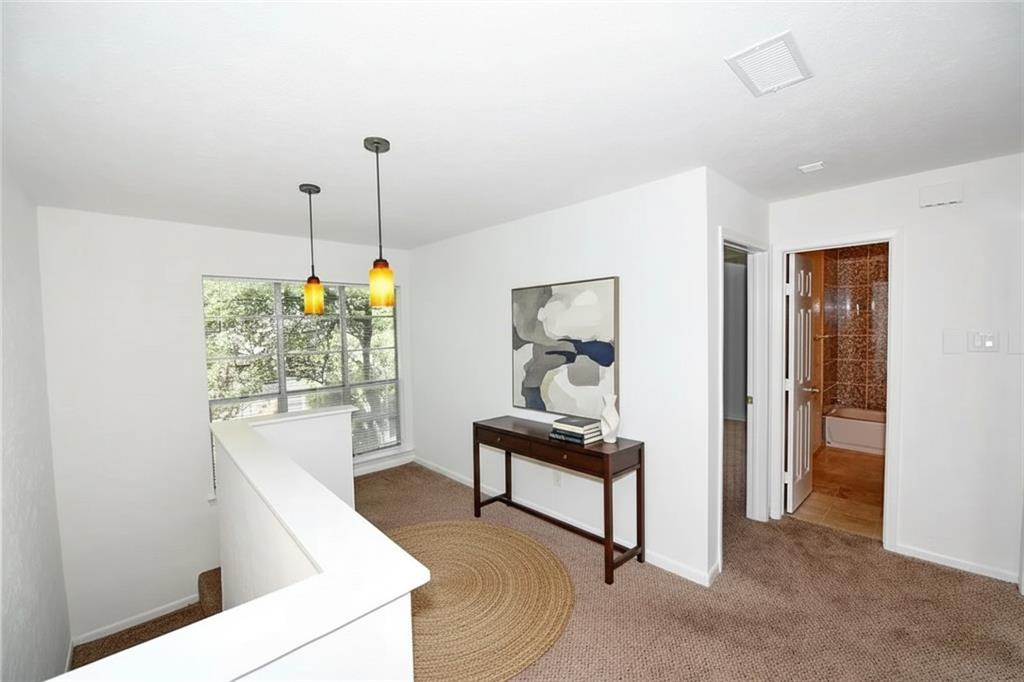 4317 Hartford Street, Unit 107 Dallas, TX 75219 - Photo 17 of 17 a living room with furniture and a chandelier