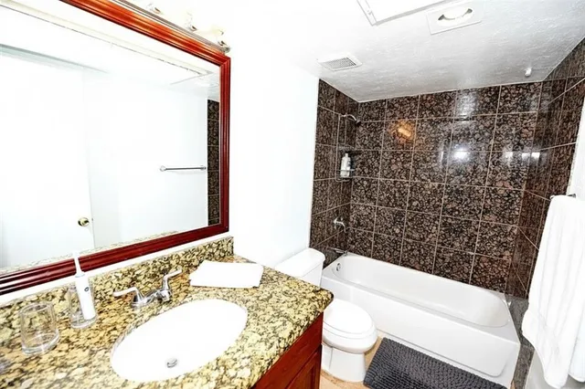 a bathroom with a bathtub and shower