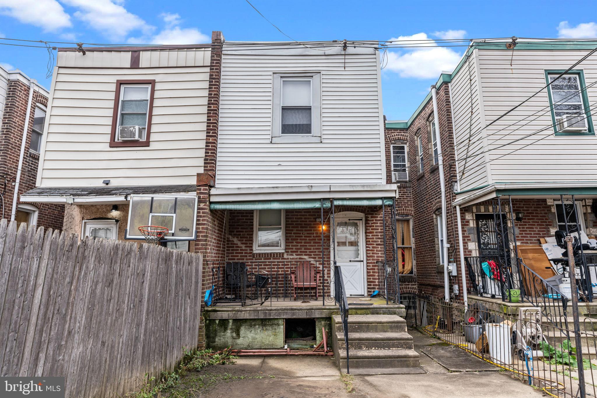 6520 Marsden Street Philadelphia, PA 19135 - Photo 25 of 26 a front view of a house with street