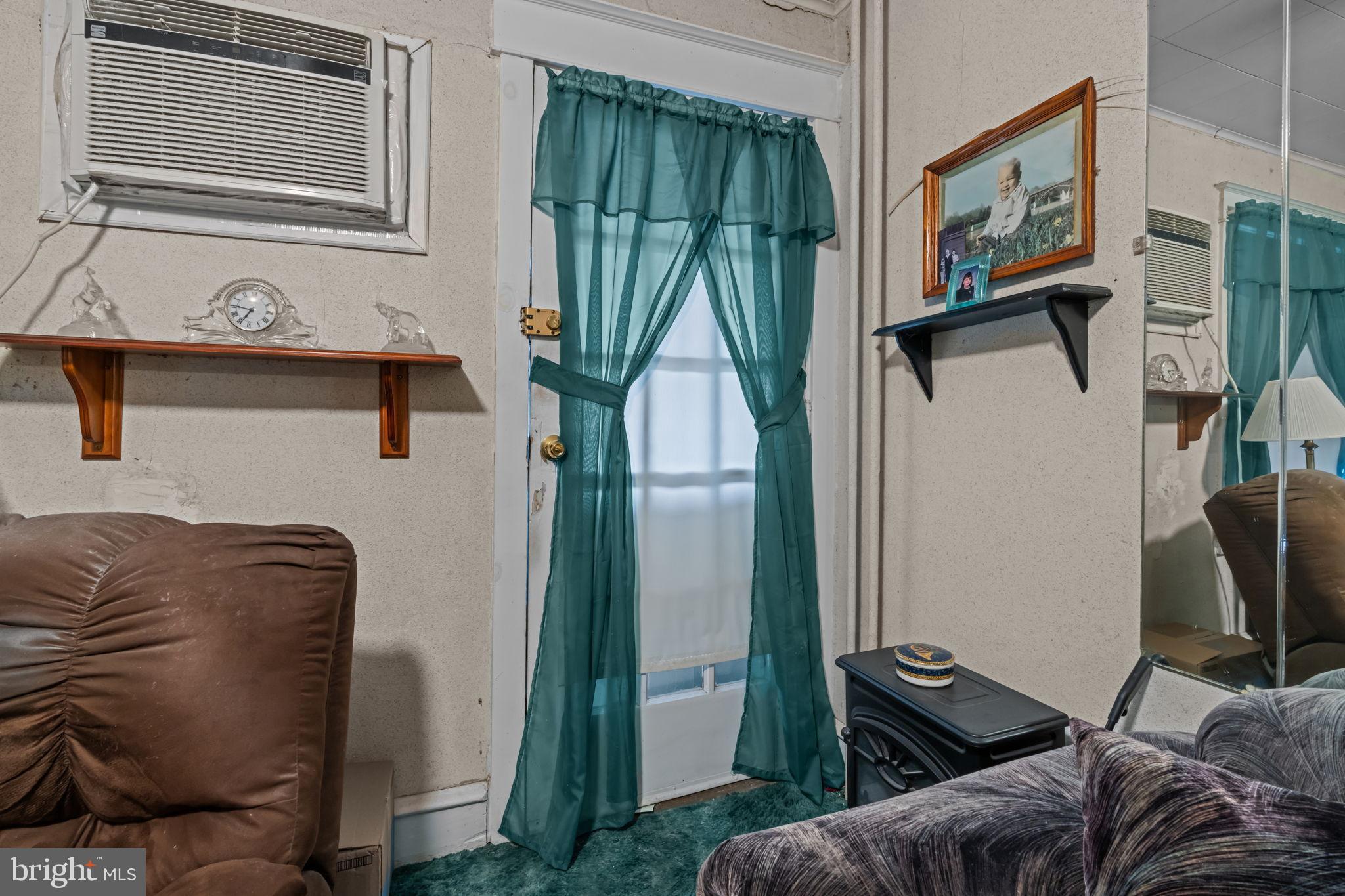 6520 Marsden Street Philadelphia, PA 19135 - Photo 5 of 26 a living room with furniture and a window