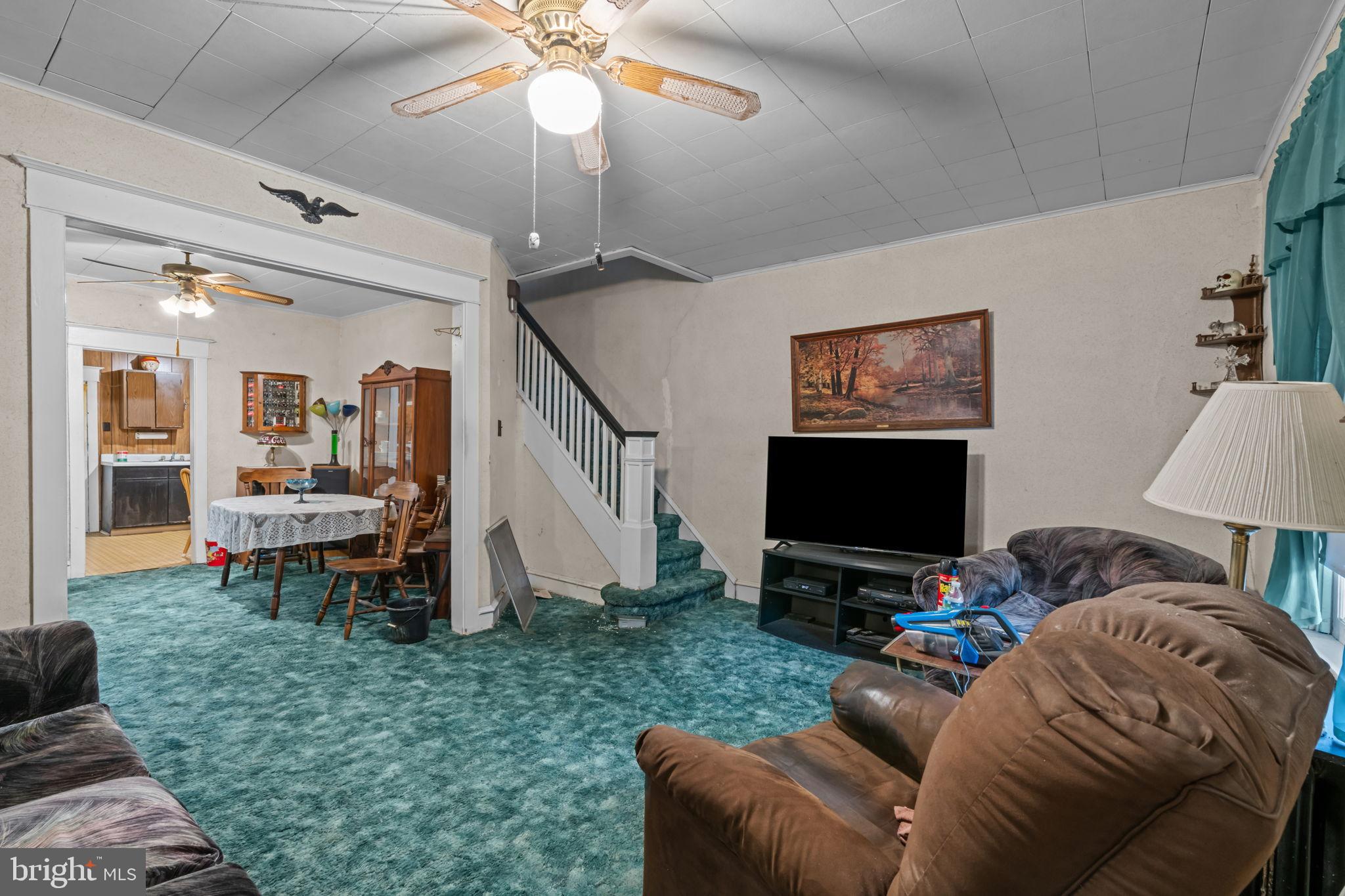6520 Marsden Street Philadelphia, PA 19135 - Photo 6 of 26 a living room with furniture and a flat screen tv