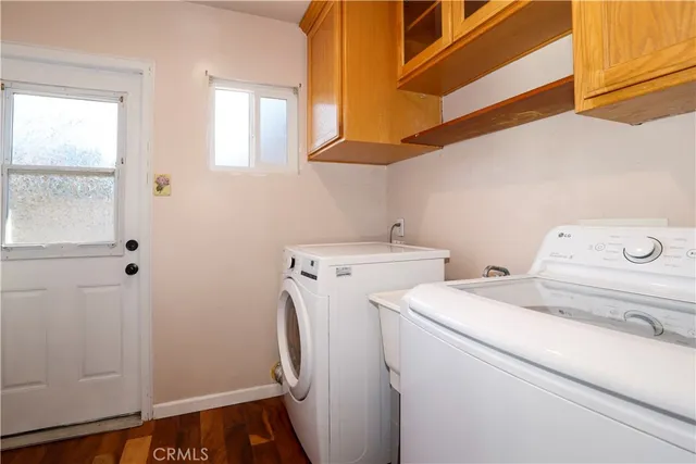 a bedroom with bed and a chandelier