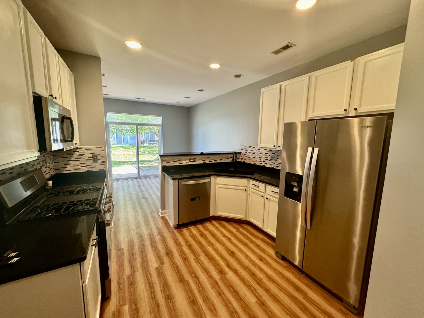 423 Acushnet Street, Unit 423 Elgin, IL 60124 - Photo 6 of 20 a kitchen with a refrigerator stove and sink
