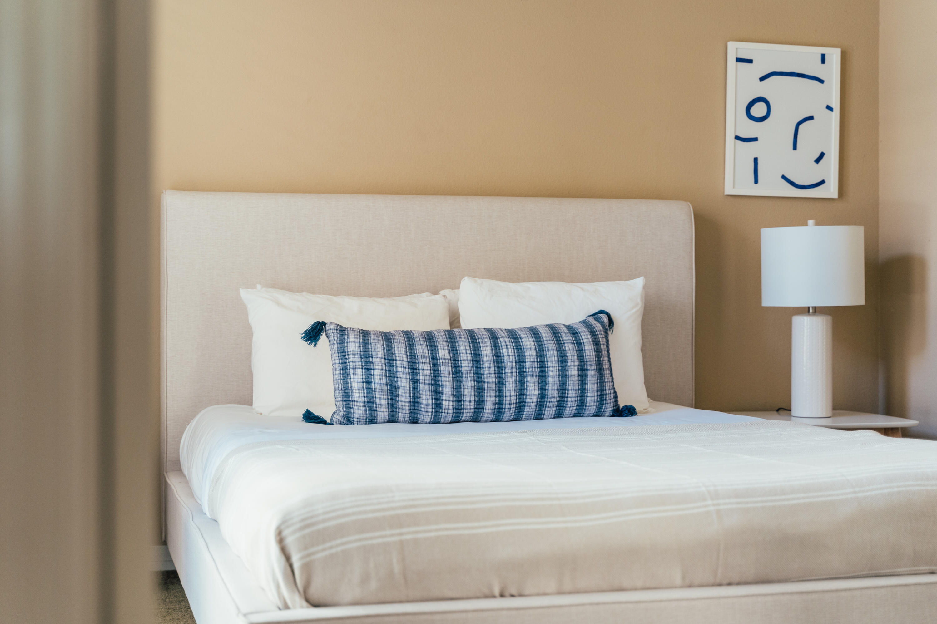 48789 Cascade Street Indio, CA 92201 - Photo 12 of 34 a bedroom with a bed and painting on the wall