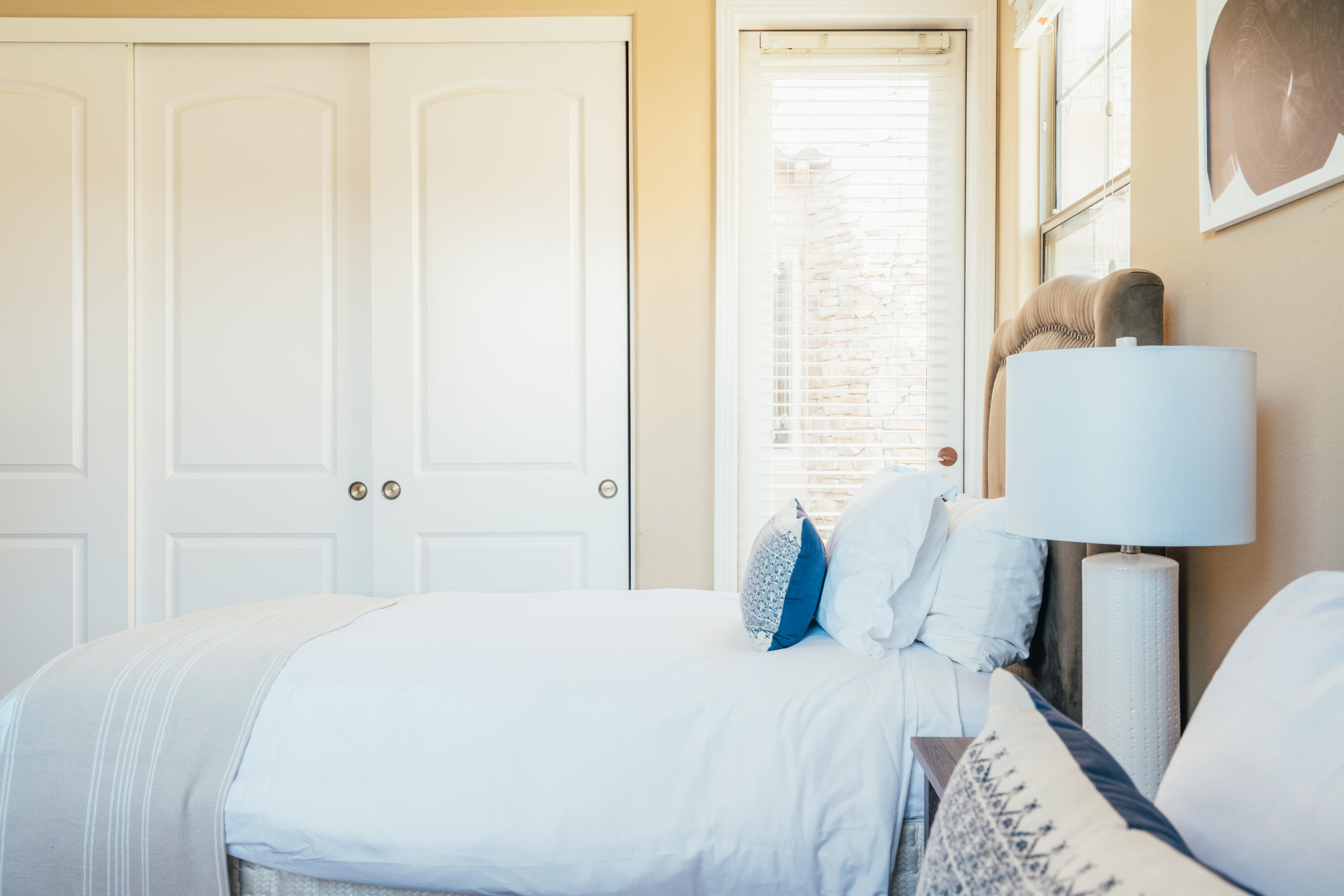 48789 Cascade Street Indio, CA 92201 - Photo 14 of 34 a bedroom with a bed and a lamp