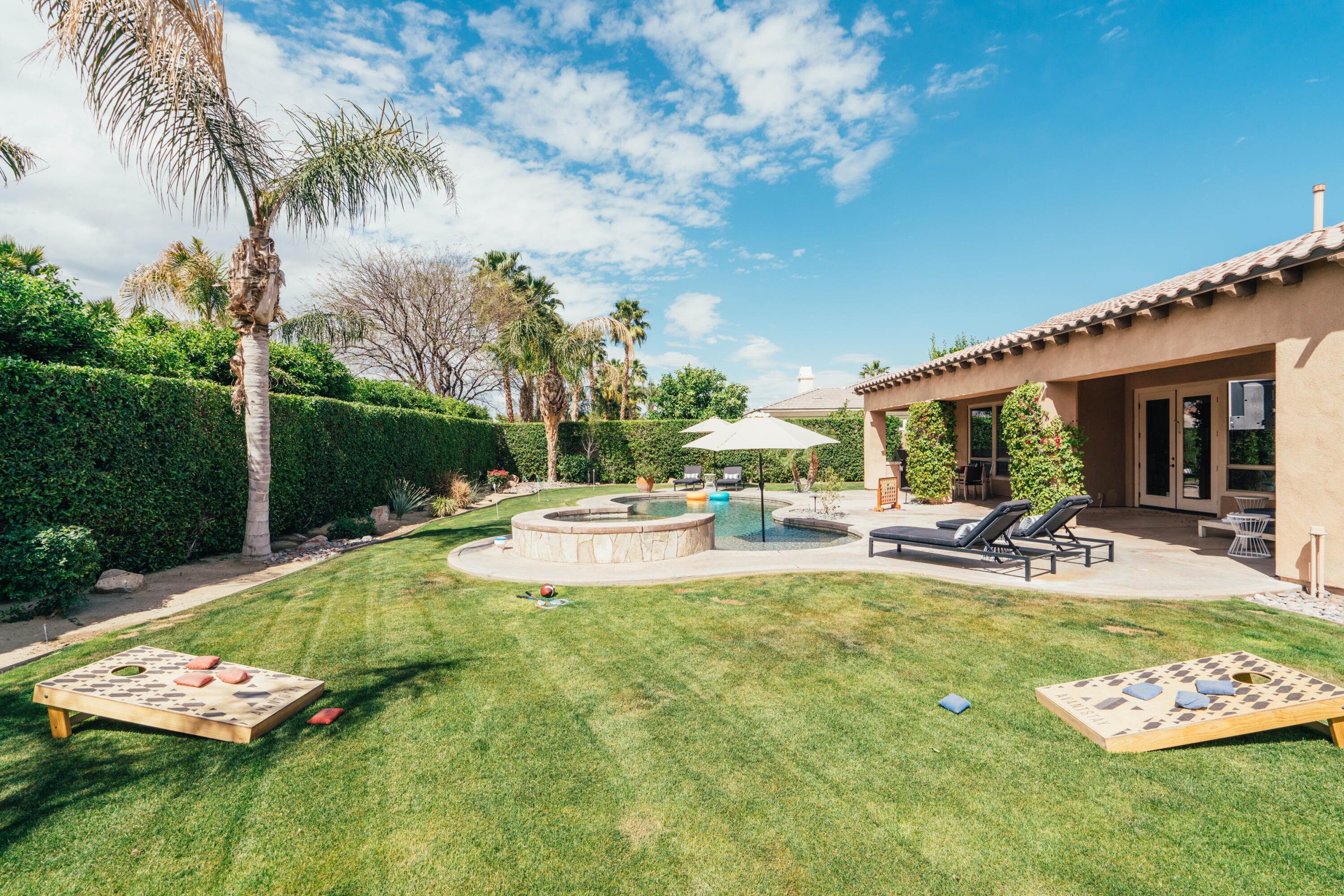 48789 Cascade Street Indio, CA 92201 - Photo 24 of 34 a view of a swimming pool with a patio