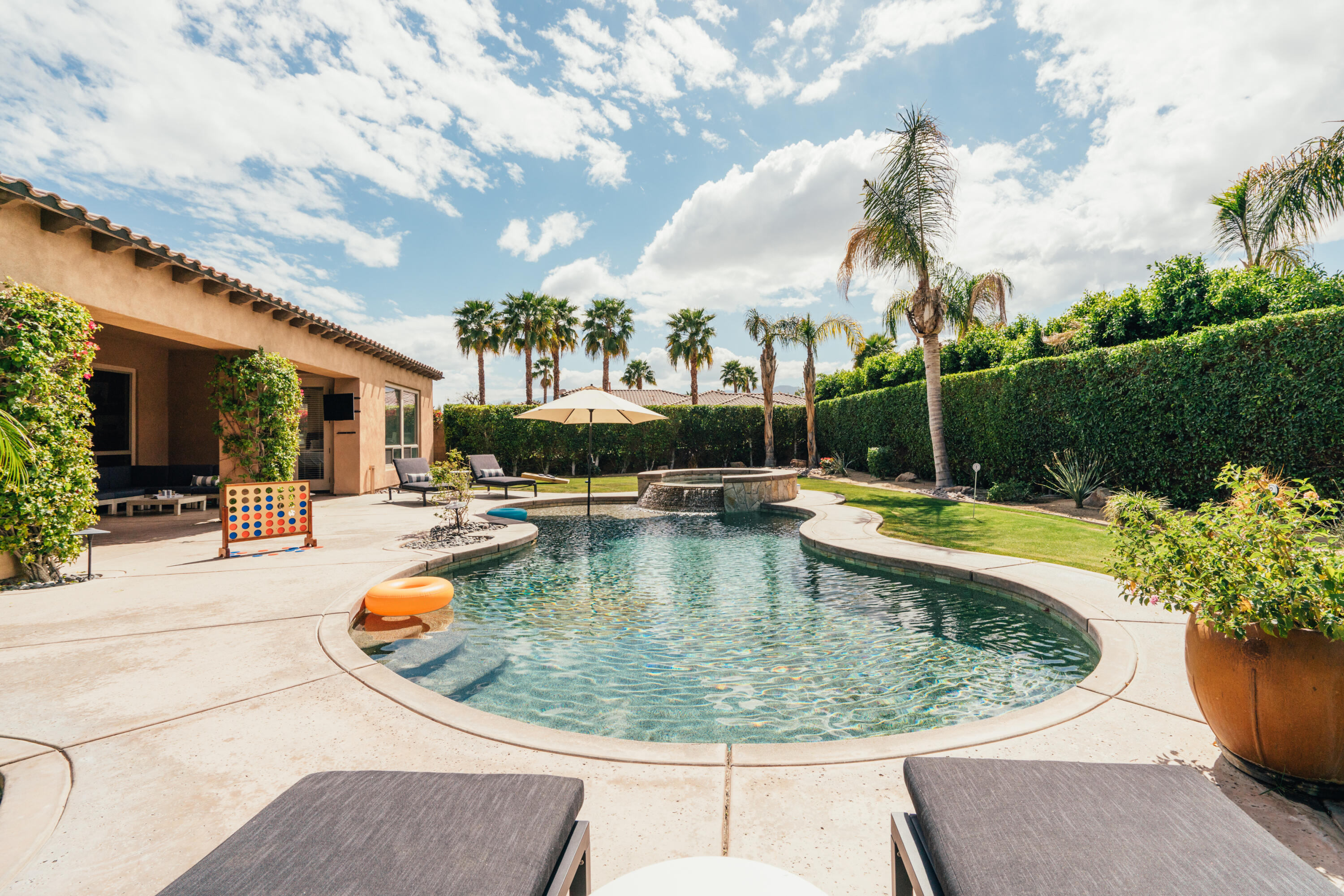 48789 Cascade Street Indio, CA 92201 - Photo 25 of 34 a view of a swimming pool with a patio