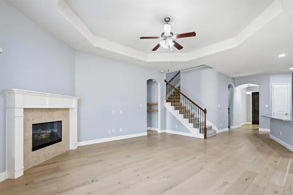 a large kitchen with granite countertop a large counter top stainless steel appliances a sink and cabinets