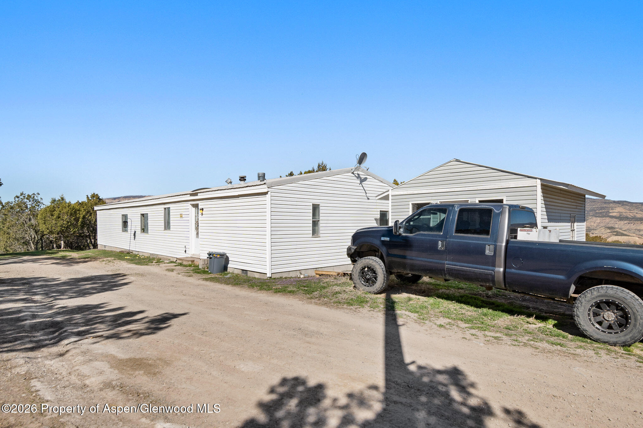 301 County Road 334A Rifle, CO 81650 - Photo 2 of 26 a front view of a house with a yard