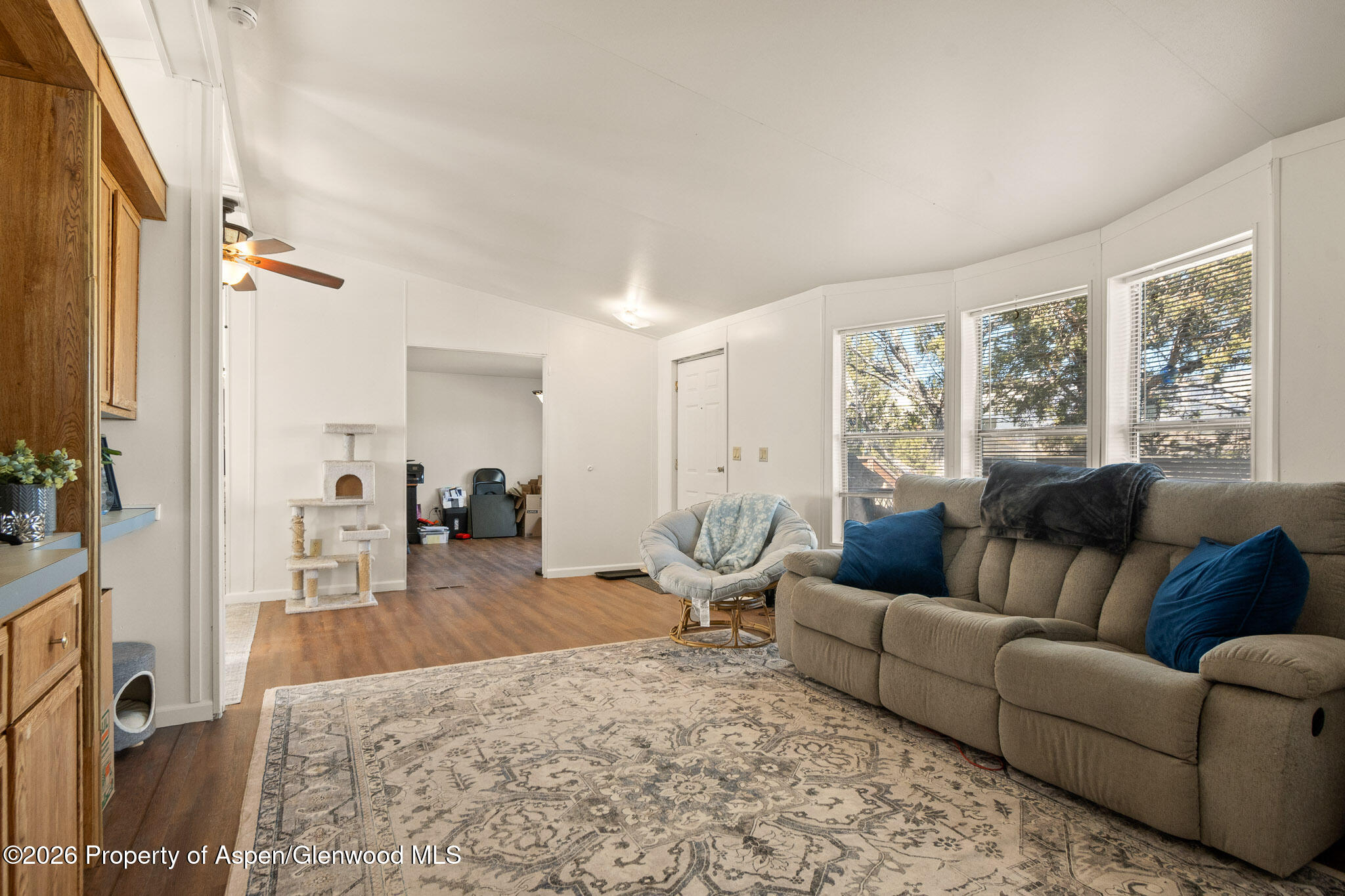 301 County Road 334A Rifle, CO 81650 - Photo 21 of 26 a living room with furniture wooden floor and a large window