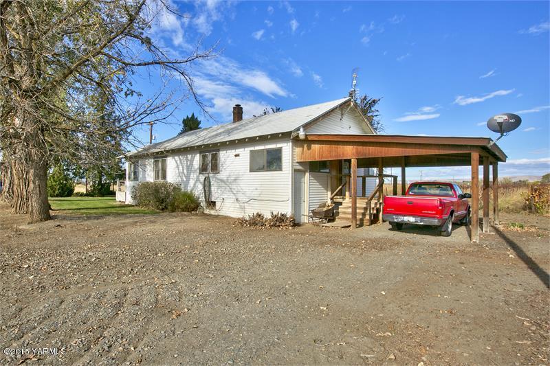 1151 McKinley Road Toppenish, WA 98948 - Photo 8 of 30 a view of a house with a cars park