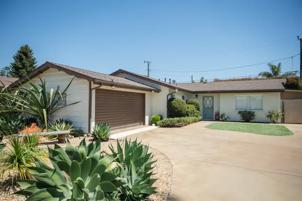 a house view with a backyard space