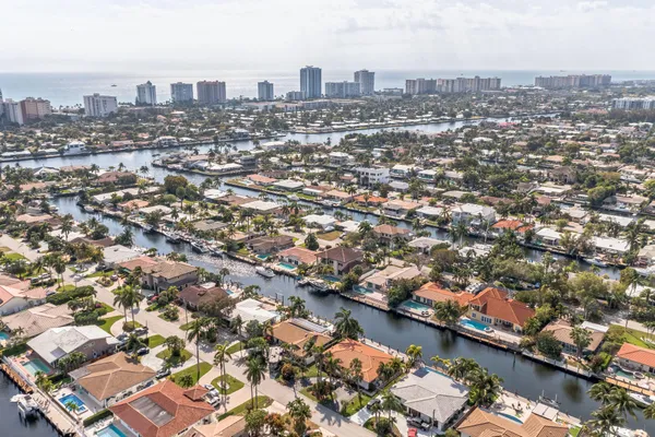 an aerial view of city and lake