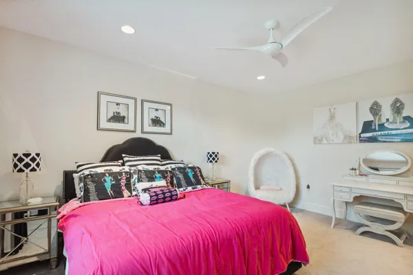 a bedroom with a bed and dresser