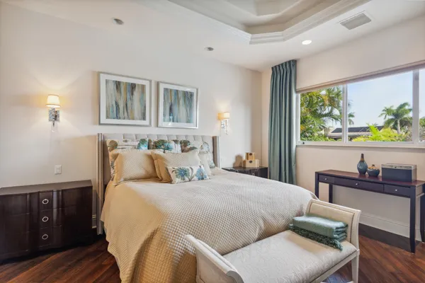 a bedroom with a bed and a desk