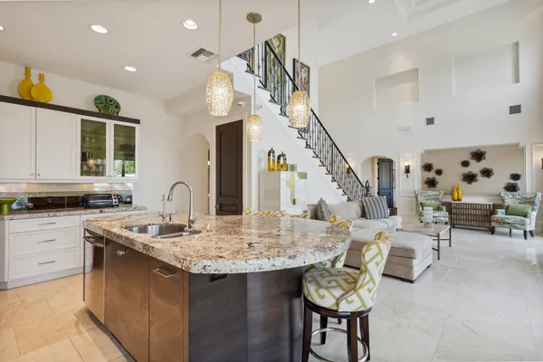 a kitchen with a table chairs stove and cabinets