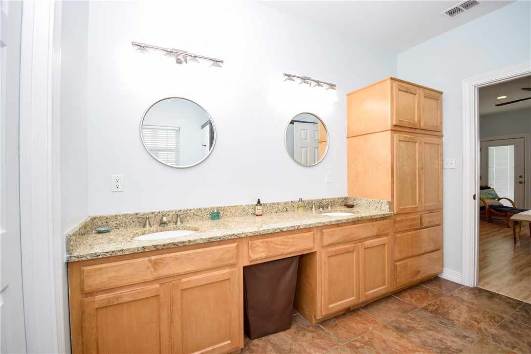 2006 1st Street Bayside, TX 78340 - Photo 23 of 37 a bathroom with a sink and a mirror
