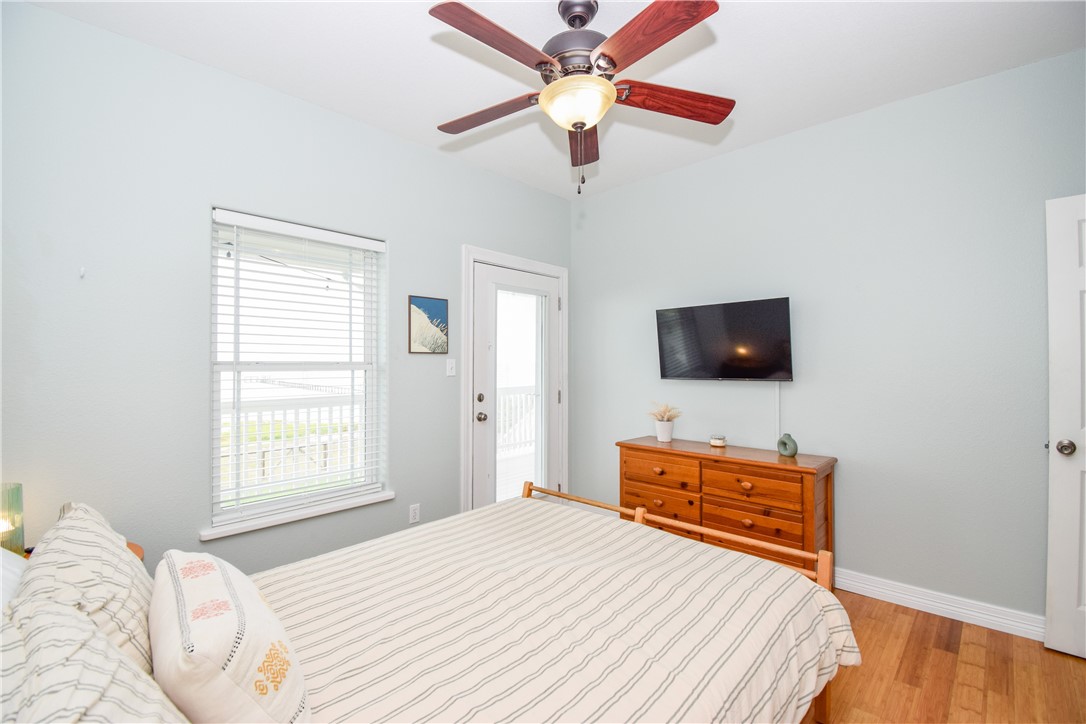 2006 1st Street Bayside, TX 78340 - Photo 25 of 37 a bedroom with a bed and a flat screen tv